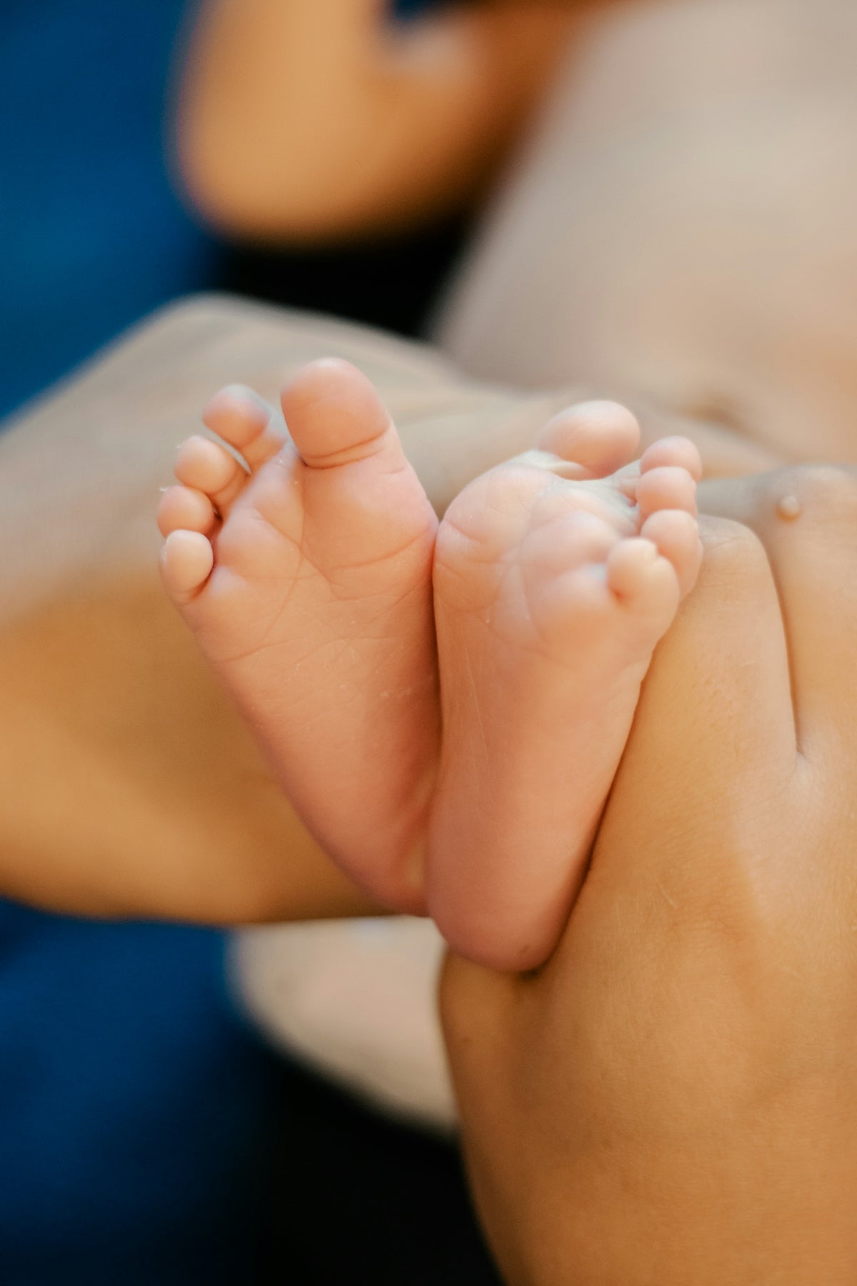a close up of a person holding a baby