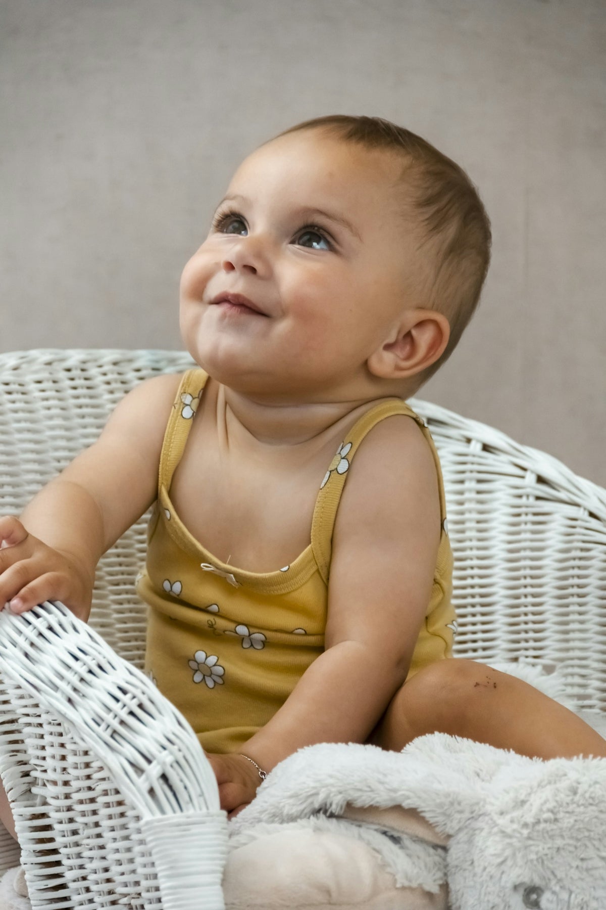 a baby sitting on a chair
